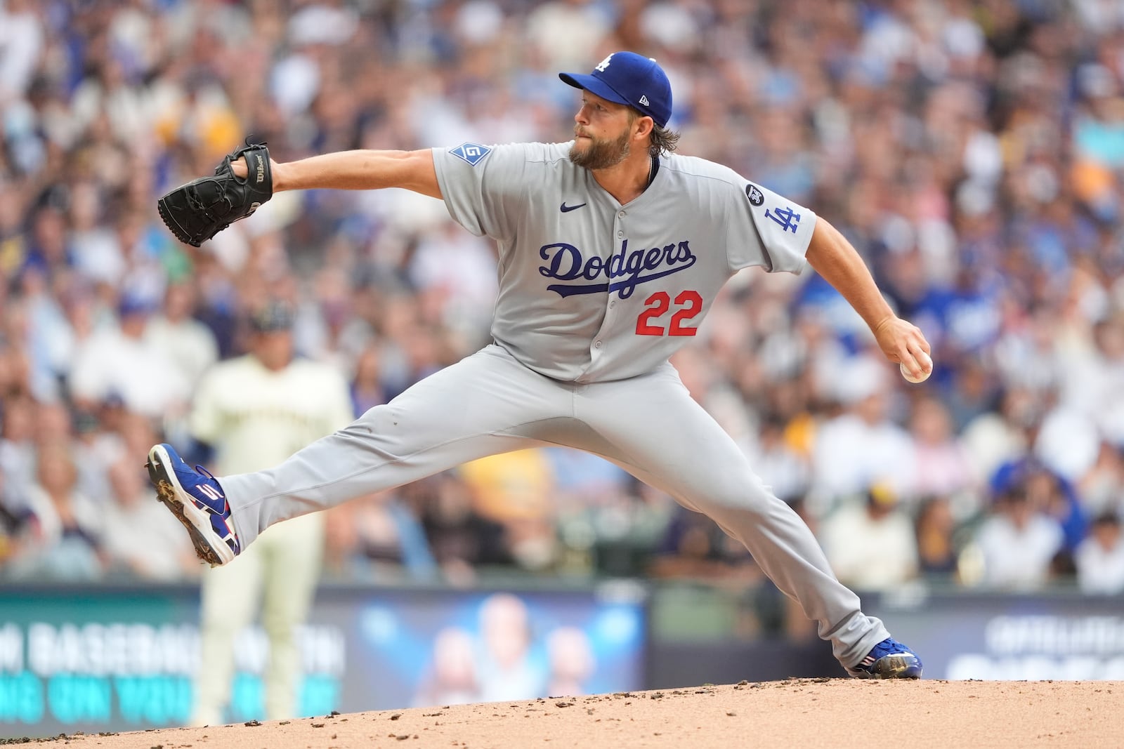 Los Angeles Dodgers' Clayton Kershaw pitches during the first inning of a baseball game against the Milwaukee Brewers, Tuesday, July 8, 2025, in Milwaukee. (AP Photo/Aaron Gash)