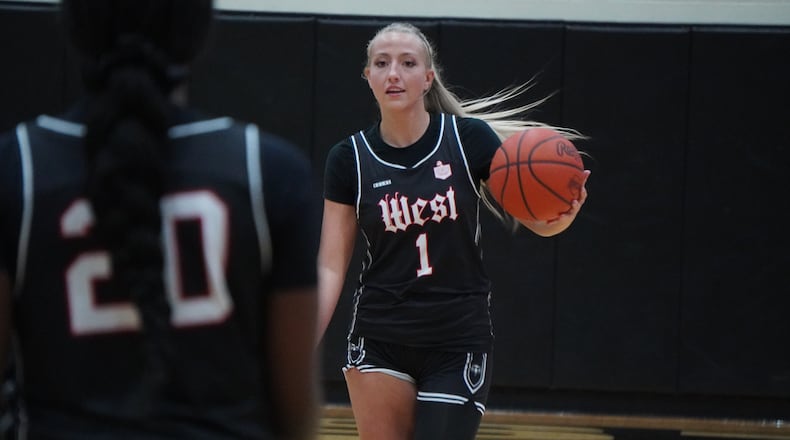 Lakota West’s Katie Fox dribbles the ball up the court against Lakota East on Friday night. CHRIS VOGT / CONTRIBUTED