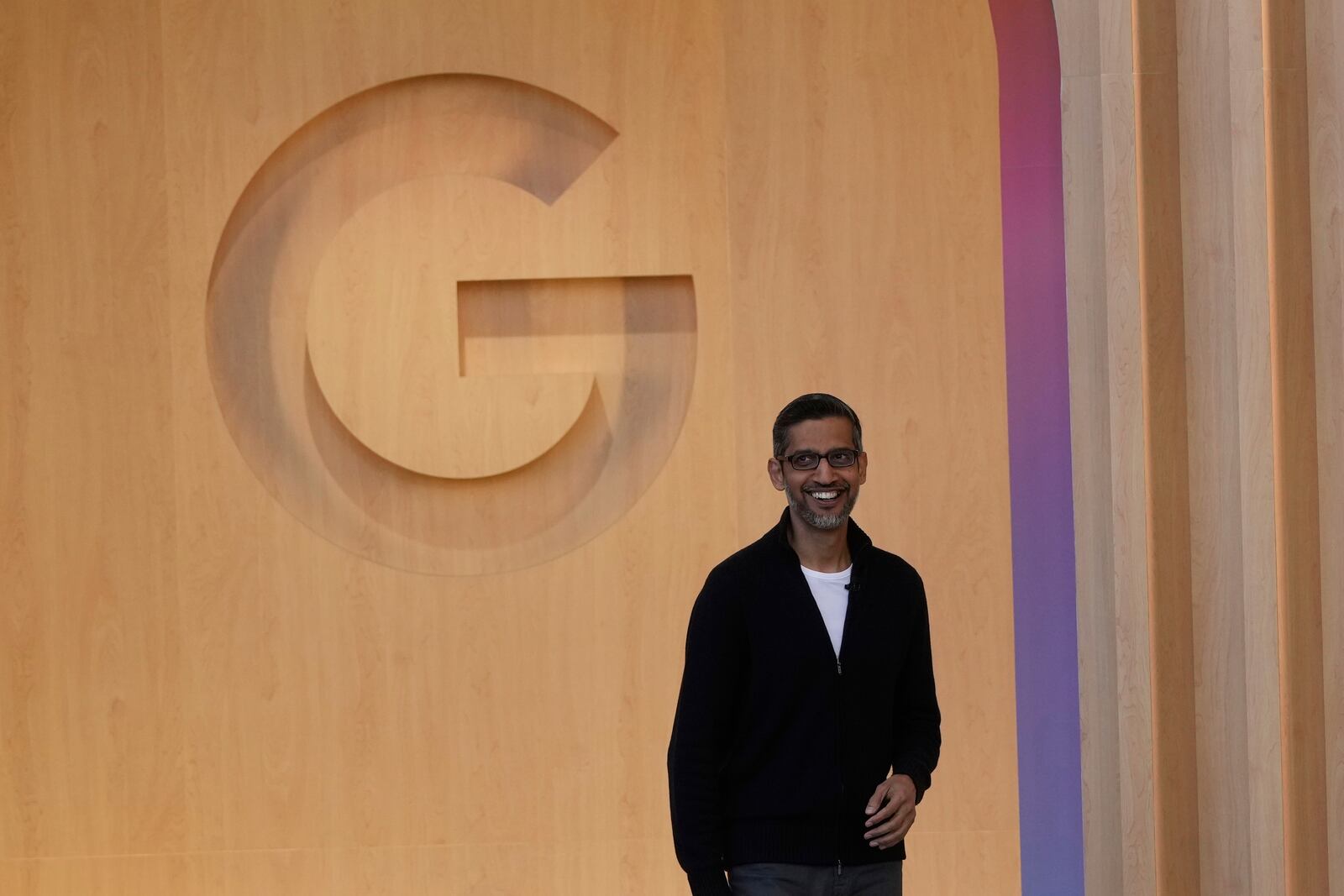 Alphabet CEO Sundar Pichai smiles as he walks onto the stage at a Google I/O event in Mountain View, Calif., Tuesday, May 20, 2025. (AP Photo/Jeff Chiu)