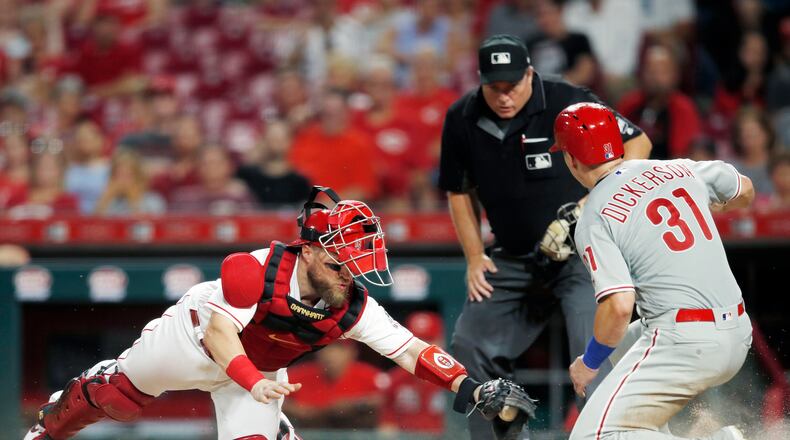 CINCINNATI, OH - SEPTEMBER 03: Corey Dickerson #31 of the Philadelphia Phillies scores a run ahead of the tag by Tucker Barnhart #16 of the Cincinnati Reds after a single by Bryce Harper in the fifth inning at Great American Ball Park on September 3, 2019 in Cincinnati, Ohio. The Phillies defeated the Reds 6-2. (Photo by Joe Robbins/Getty Images)