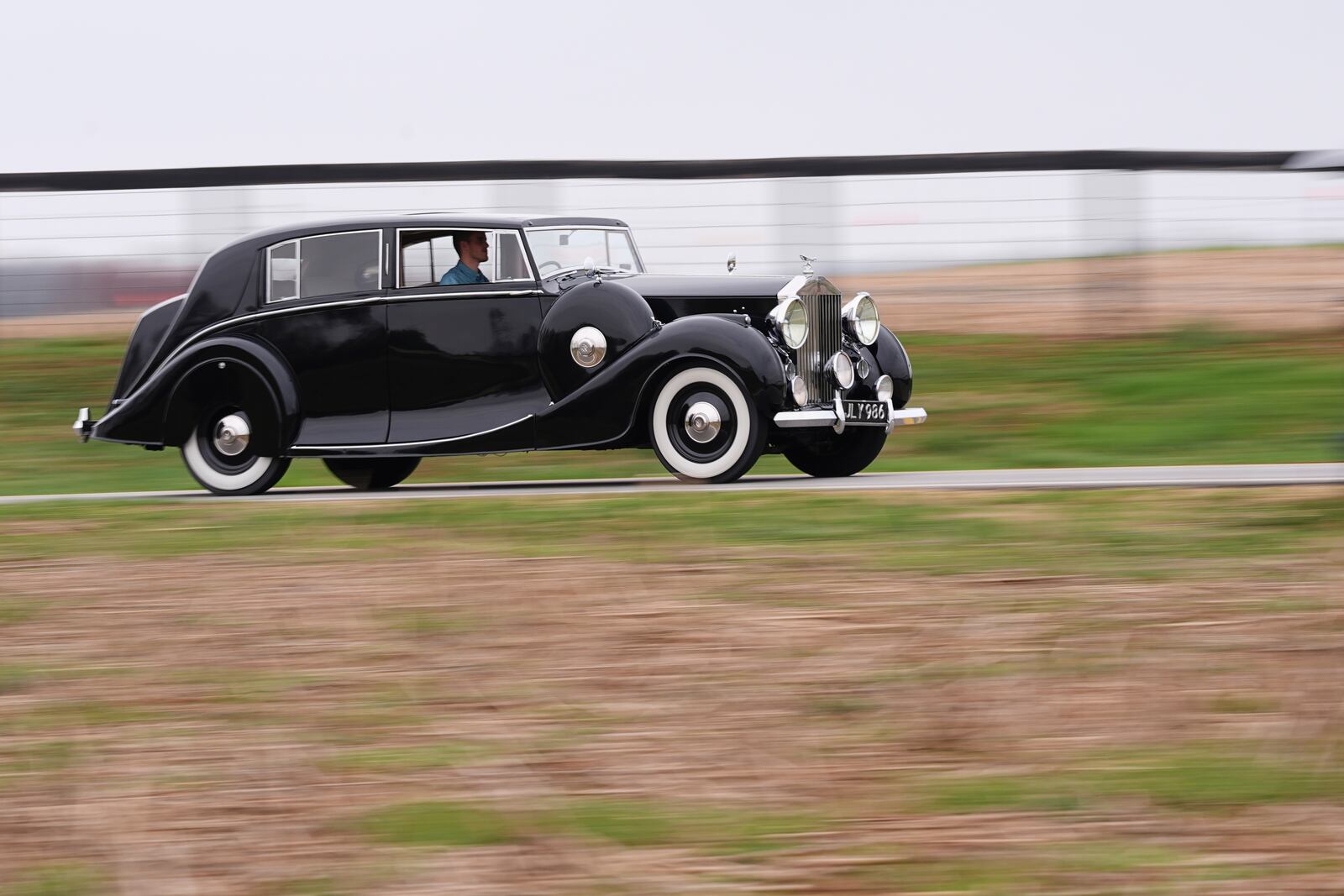 Mike Fowler drives a 1946 Rolls-Royce Silver Wraith from the The Rolls-Royce Foundation's collection in Mechanicsburg, Pa., Saturday, April 5, 2025. (AP Photo/Matt Rourke)