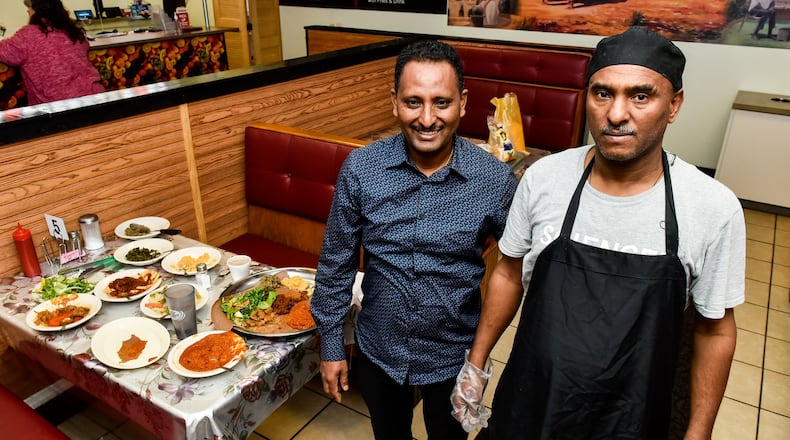 Hagos Tela, left, and Solomon Siyoum opened Hamilton Diner at 2535 Pleasant Avenue in Lindenwald neighborhood of Hamilton. They opened in the former site of Dean’s Grill and Lindenwald Station offering a new dining option in Butler County. The new restaurant offers American and Ethiopian cuisine. NICK GRAHAM/STAFF