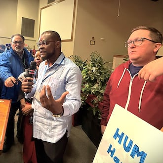 Viles Dorsainvil, the co-founder and executive director of the Haitian Community Help & Support Center in Springfield, spoke at a community event in Springfield on Monday, Feb. 2, 2026, in support of extending temporary protected status for Haiti. Dorsainvil and his brother are plaintiffs in lawsuits challenging the Trump administration's cancellation of TPS for Haitians. He stood next to Geoff Pipoly, lead counsel in a federal court case in Washington, DC. CORNELIUS FROLIK / STAFF