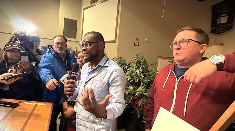 Viles Dorsainvil, the co-founder and executive director of the Haitian Community Help & Support Center in Springfield, spoke at a community event in Springfield on Monday, Feb. 2, 2026, in support of extending temporary protected status for Haiti. Dorsainvil and his brother are plaintiffs in lawsuits challenging the Trump administration's cancellation of TPS for Haitians. He stood next to Geoff Pipoly, lead counsel in a federal court case in Washington, DC. CORNELIUS FROLIK / STAFF