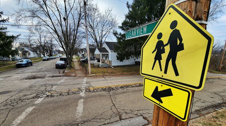 The city of Hamilton received a $250,000 Safe Routes to Schools grant from the Ohio Department of Transportation. It will install new sidewalks and ADA-compliant curb ramps, crosswalks, and signage around Crawford Woods Elementary School. NICK GRAHAM/FILE