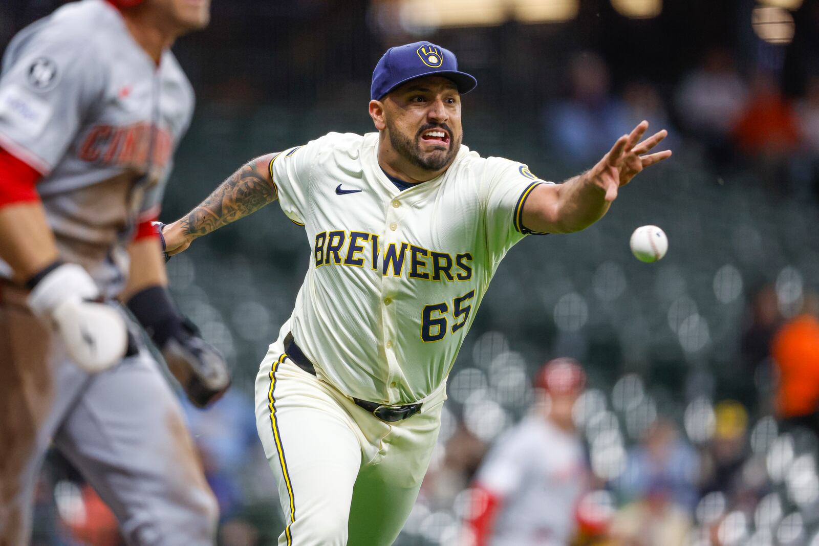 Milwaukee Brewers starting pitcher Nestor Cortes throws out Cincinnati Reds' TJ Friedl (29) during the third inning of a baseball game Thursday, April 3, 2025, in Milwaukee. (AP Photo/Jeffrey Phelps)