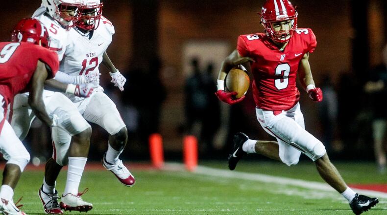 Fairfield’s Peyton Brown carries the ball during a game against visiting Lakota West on Sept. 14 at Fairfield Stadium. Fairfield won 37-3. NICK GRAHAM/STAFF