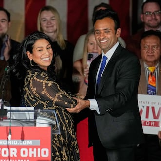 Apoorva Ramaswamy, left, greets her husband, Vivek Ramaswamy, right, a Republican candidate for governor of Ohio, at a rally Wednesday, Jan. 7, 2026, in Cleveland. (AP Photo/Sue Ogrocki)