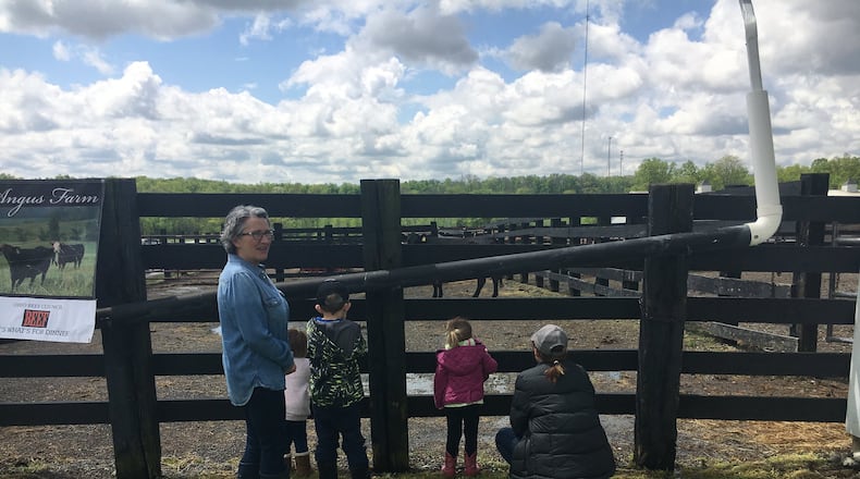 People in May visited Pedro’s Angus Farm in Milford Township to experience a working farm and learn about its operations. Farmers and prospective agricultural entrepreneurs are invited to a class about diverse farming options in coming months. MIKE RUTLEDGE / STAFF