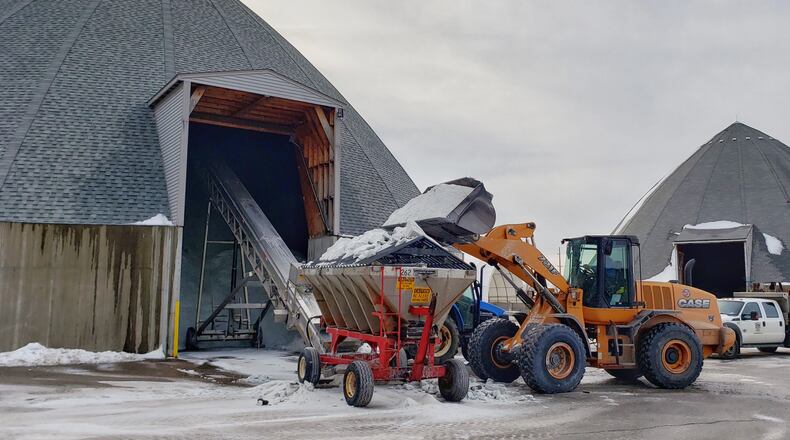 Crews at the Butler County Engineer’s Office clean plow trucks and replenish the salt supply Tuesday, Jan. 22 after two weekends of snow events in the area. NICK GRAHAM/STAFF