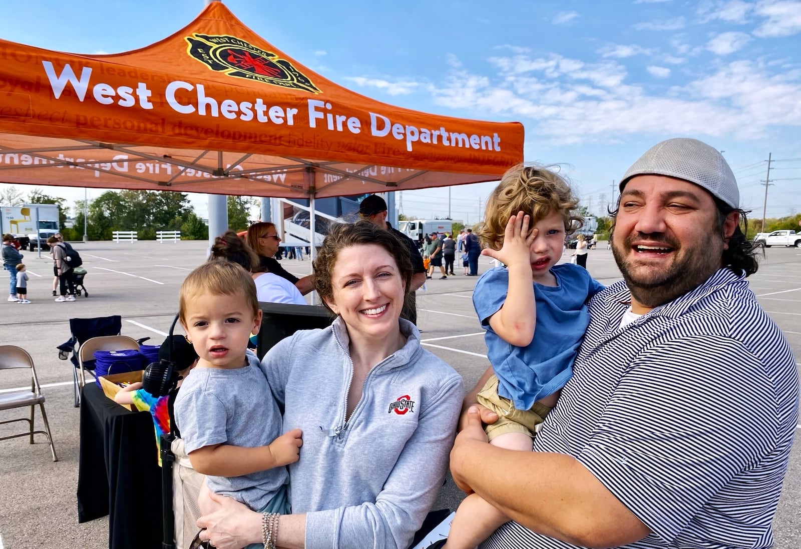 Saturday's Touch-A-Truck event in West Chester Twp. saw young children happily clamored around and through West Chester Fire, Police, EMS, Haz Mat and SWAT vehicles, as well as Butler County emergency services vehicles and farm tractors, all parked outside the Ikea store near the Interstate 75 and Union Centre Blvd interchange. Among the hundreds of families attending were the Shusters from West Chester. (Photo By Michael D. Clark/Journal-News)