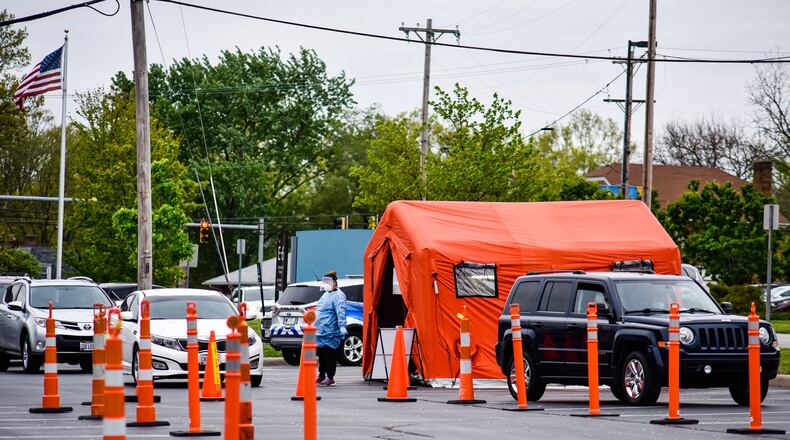 Cars line up for COVID-19 testing Tuesday, May 5, 2020 at Fort Hamilton Hospital in Hamilton. NICK GRAHAM / STAFF
