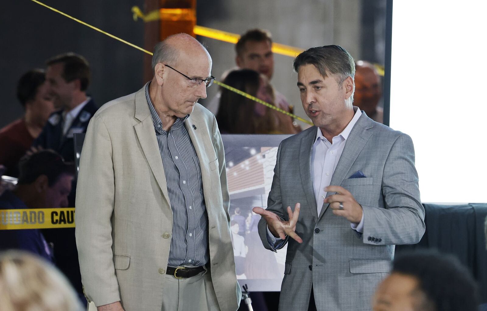 Hamilton Mayor Pat Moeller, left, and City Manager Joshua Smith talk before the annual State of the City Address to the business community at the former Danbarry/Cinema 10 theater on NW Washington Blvd. Thursday, Oct. 6, 2022 in Hamilton. NICK GRAHAM/STAFF