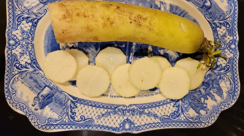 Daikon is a white radish that is much larger than the familiar red globe-shaped radish, and shaped differently. CONTRIBUTED