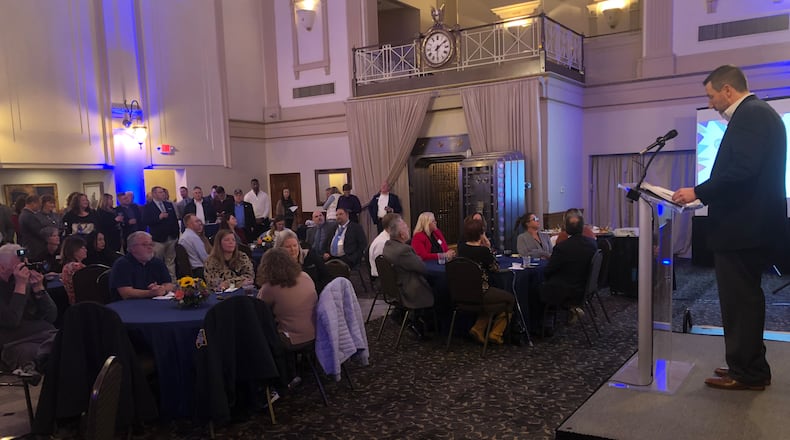 Chip Hitte, commercial team lead and senior vice president of  First Financial Bank and 2023 chairman of the board for the Chamber of Commerce serving Middletown, Monroe and Trenton, addresses the crowd Thursday night at the Windamere Event Venue in Middletown. RICK McCRABB/STAFF