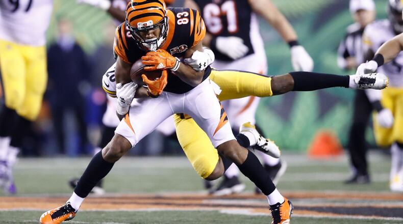 CINCINNATI, OH - DECEMBER 04: Tyler Boyd #83 of the Cincinnati Bengals is tackled by Sean Davis #28 of the Pittsburgh Steelers during the first half at Paul Brown Stadium on December 4, 2017 in Cincinnati, Ohio. (Photo by Andy Lyons/Getty Images)