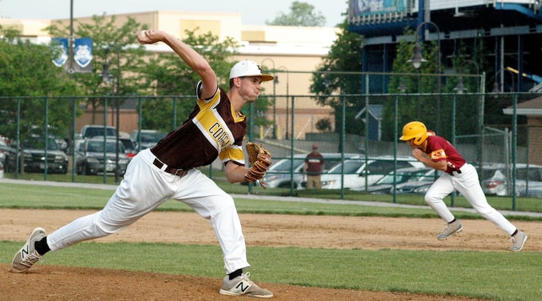 Springfield Kenton Ridge pitcher Collin Perkins delivers to the plate as Ryan Merkle of Ross takes off for second base Thursday during a Division II district baseball final at Hamilton’s Stang Field. Ross won 1-0. RICK CASSANO/STAFF
