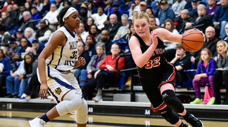 Lakota West’s Abby Prohaska dribbles around Walnut Hills’ Zuri Williams during Wednesday night’s Division I regional semifinal at Fairmont’s Trent Arena. West won 60-31. NICK GRAHAM/STAFF