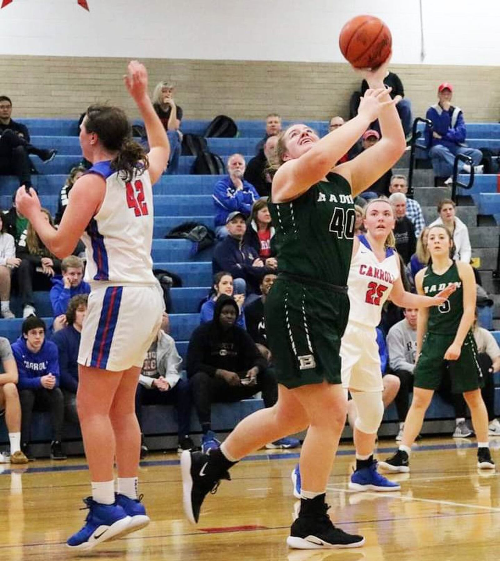 Badin’s Emma Broermann (40) gets around Carroll’s Julia Keller (42) for a shot Saturday afternoon in Riverside. Carroll won 64-57. CONTRIBUTED PHOTO BY TERRI ADAMS