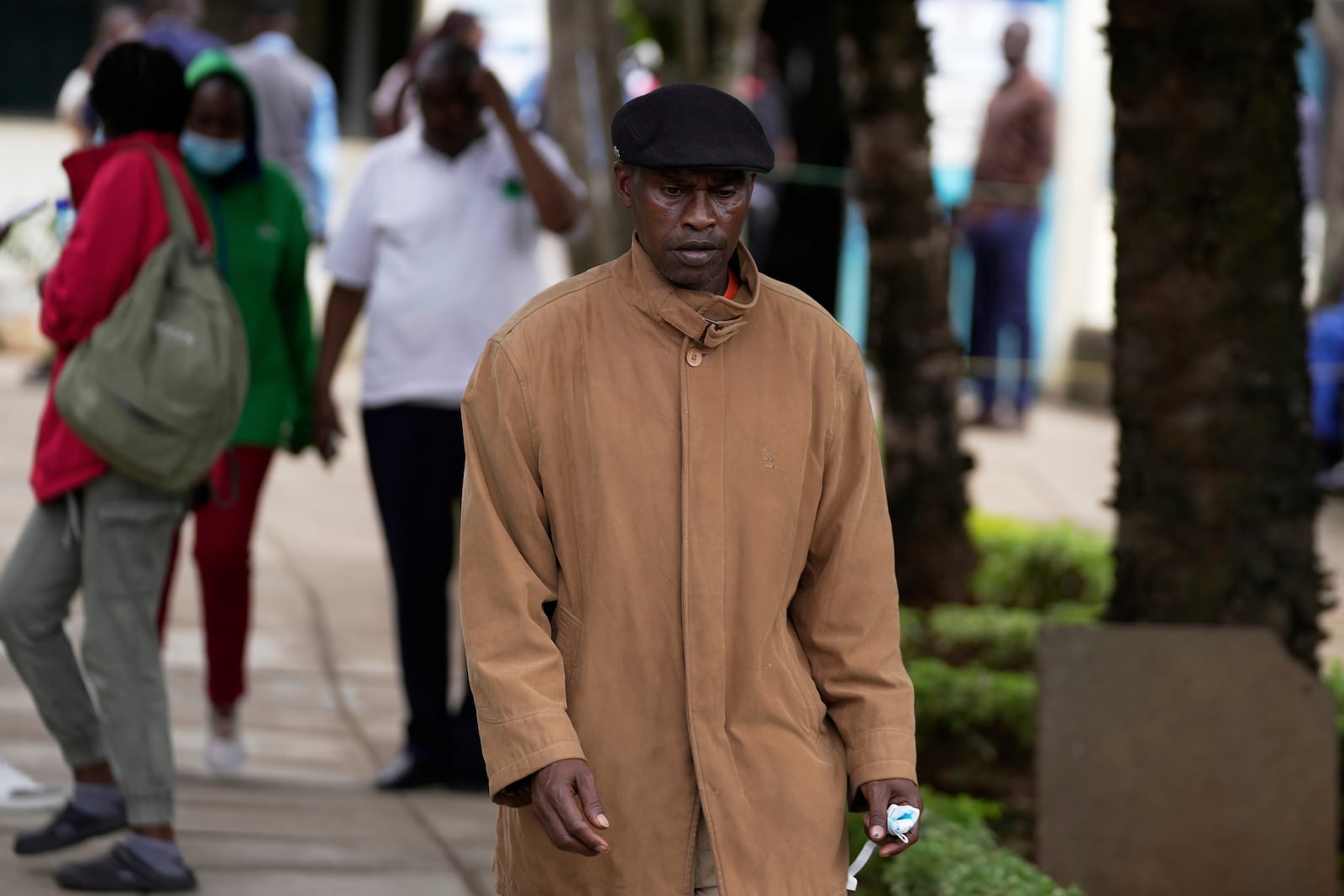 Jonah Kariuki, 50, whose son Boniface Kariuki was shot at close range by a Kenyan police officer during a protest, walks out of Kenyatta National Hospital in Nairobi, Kenya Wednesday, June 18, 2025. (AP Photo/Brian Inganga)