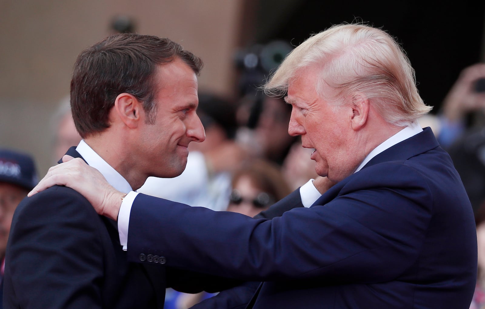 FILE - French President Emmanuel Macron, left, meets U.S President Donald Trump during a ceremony to mark the 75th anniversary of D-Day at the Normandy American Cemetery in Colleville-sur-Mer, Normandy, France, on June 6, 2019. (Ian Langsdon/Pool via AP, File)