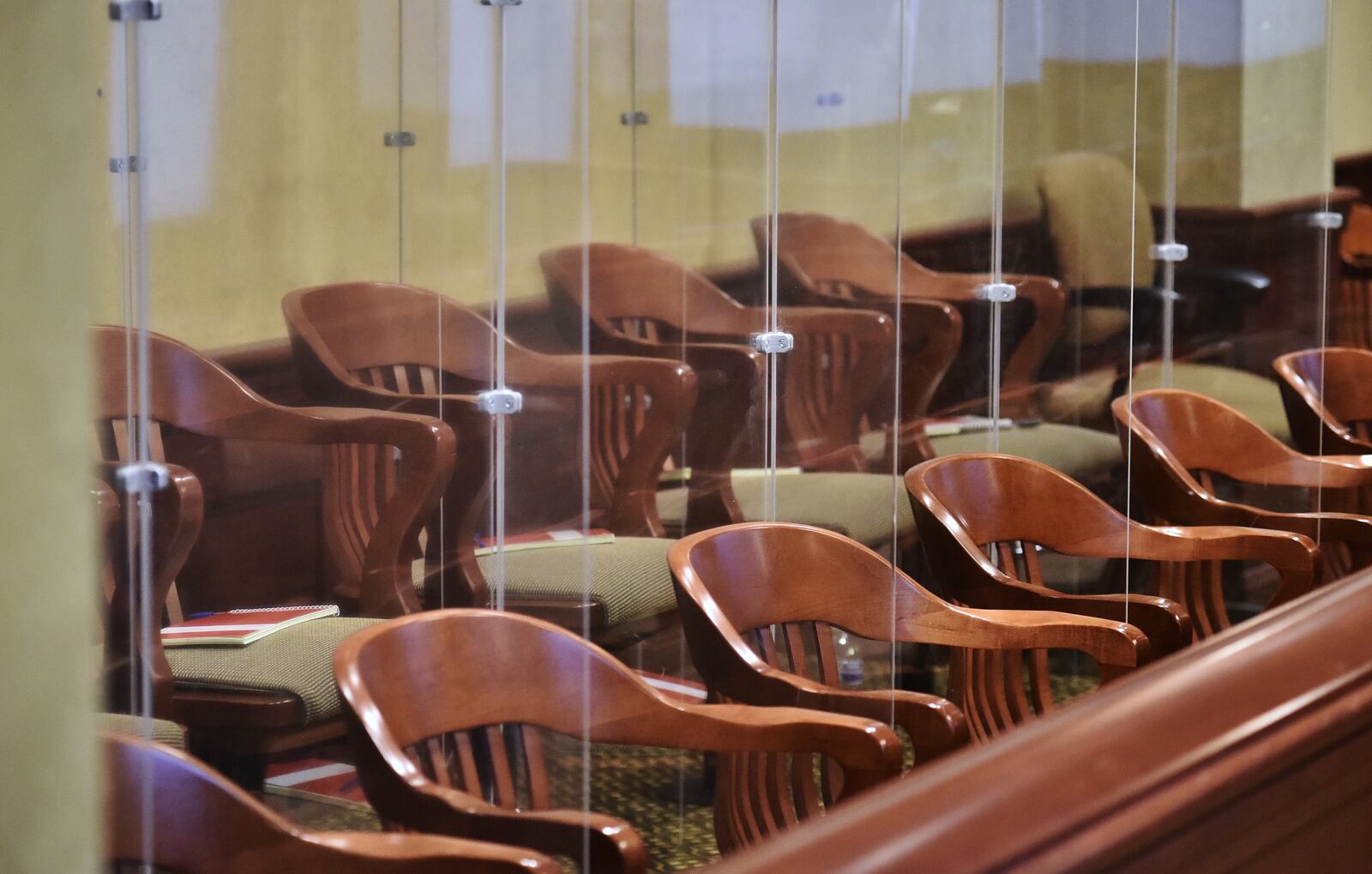 Jurors are divided by transparent panels during the trial of Peyton McFarland for the death of Chris Hacker Tuesday, April 20, 2021 in Butler County Common Pleas Court in Hamilton. The defense says McFarland acted in self defense when he stabbed Chris Hacker to death at their Monroe residence. NICK GRAHAM / STAFF
