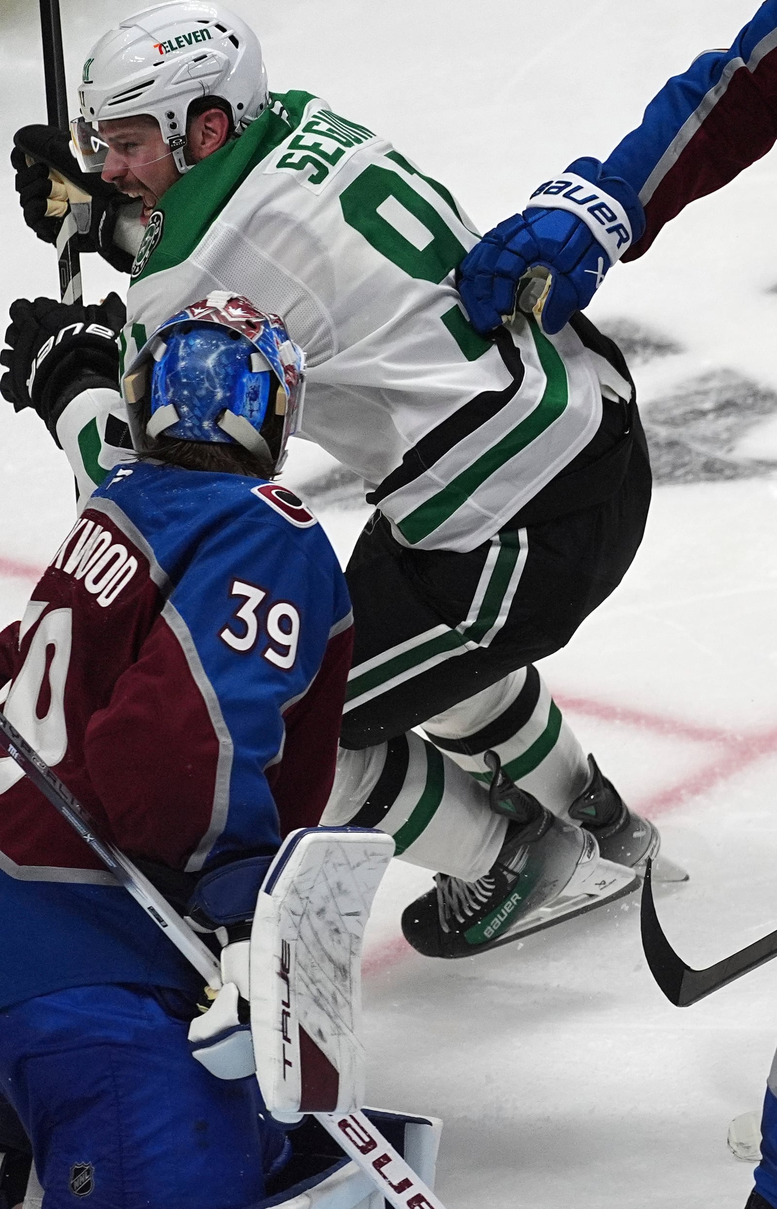 Dallas Stars center Tyler Seguin, back, reacts after scoring the winning goal against Colorado Avalanche goaltender Mackenzie Blackwood in overtime of Game 3 of an NHL hockey first-round playoff series Wednesday, April 23, 2025, in Denver. (AP Photo/David Zalubowski)