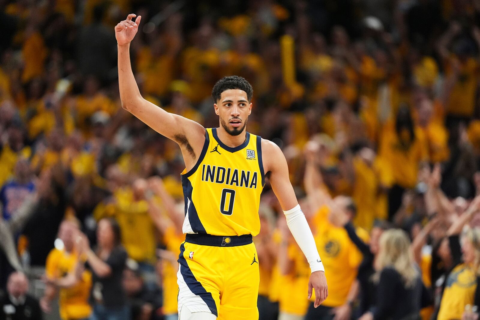 Indiana Pacers guard Tyrese Haliburton (0) celebrates during the second half of Game 6 of the Eastern Conference finals of the NBA basketball playoffs against the New York Knicks in Indianapolis, Saturday, May 31, 2025. (AP Photo/Michael Conroy)