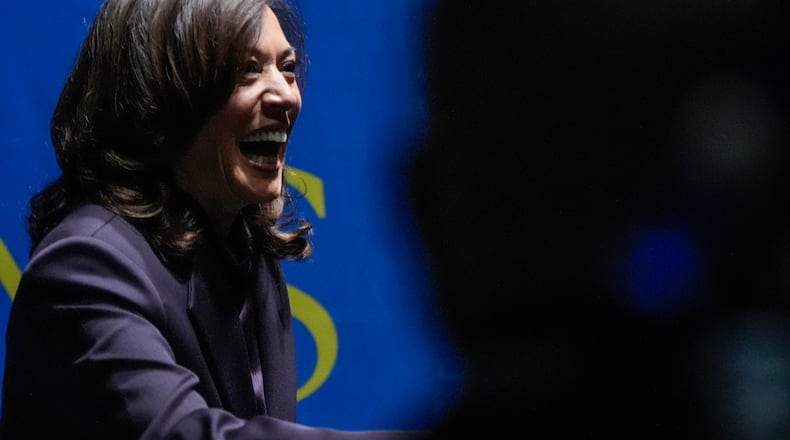 Former Vice President Kamala Harris greets people before she speaks, Friday, Oct. 17, 2025, in Birmingham, Ala. (AP Photo/Mike Stewart)