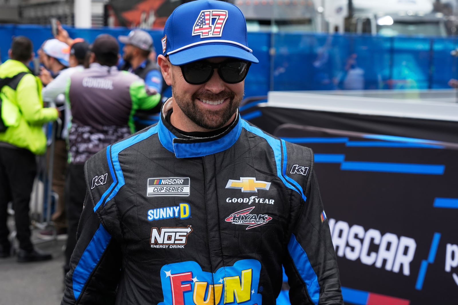 Ricky Stenhouse Jr. walks to his car before a NASCAR Cup Series auto race at Hermanos Rodríguez race track in Mexico City, Sunday, June 15, 2025. (AP Photo/)