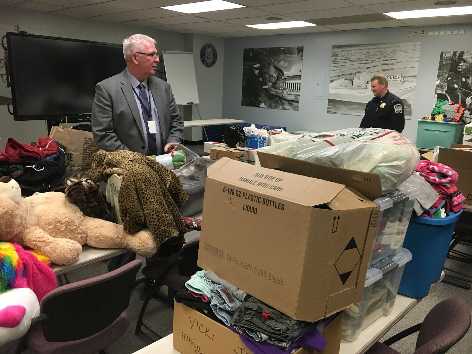 After a Middletown woman died in December 2017, Middletown police collected donations for her nine children. Pictured are Middletown Police Chief Rodney Muterspaw and Maj. David Birk with some of the items that have been donated. RICK McCRABB//FILE (2017)
