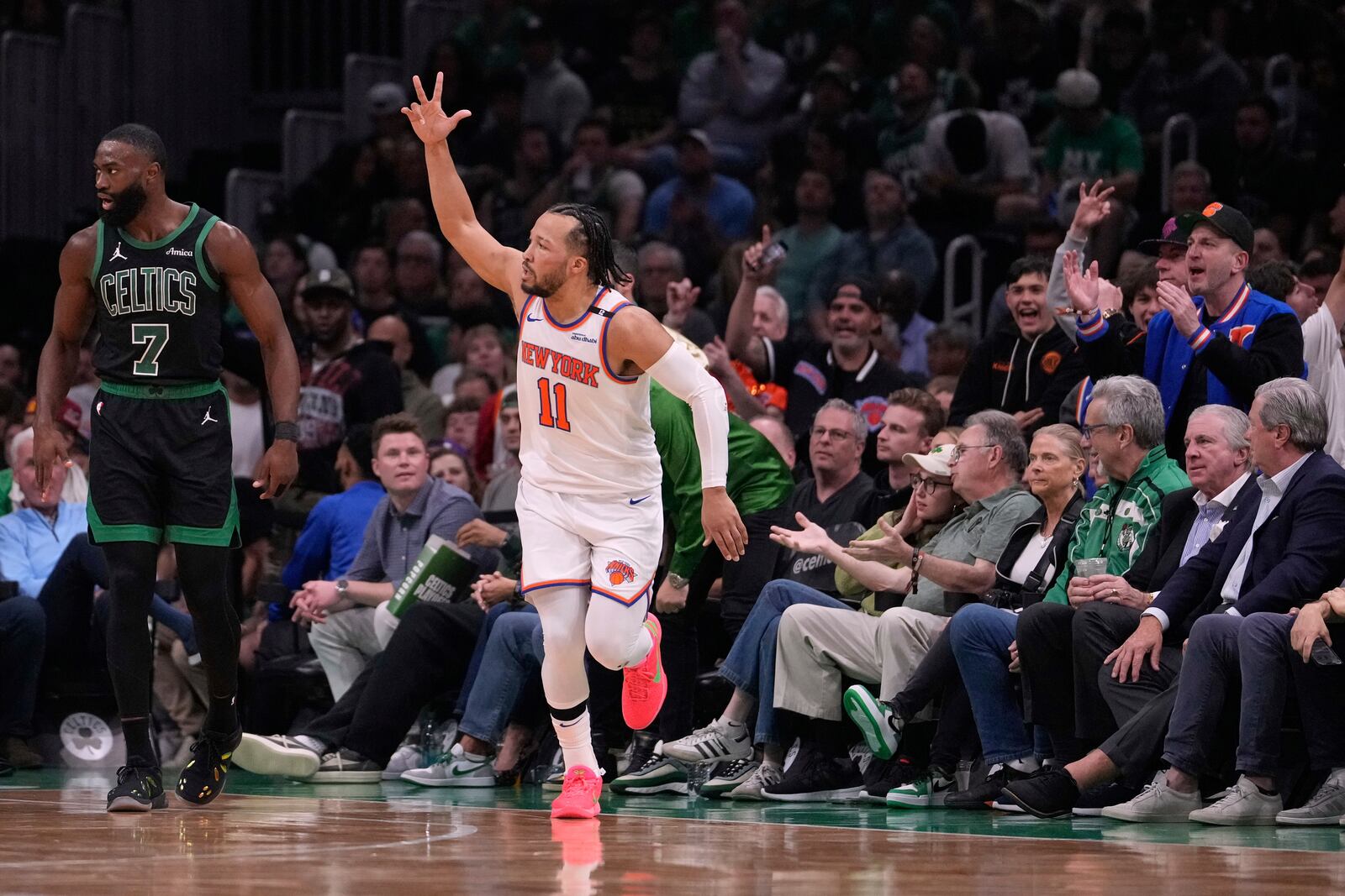 New York Knicks guard Jalen Brunson (11) celebrates after hitting a 3-pointer during the first half of Game 5 of an NBA basketball second-round playoff series against the Boston Celtics, Wednesday, May 14, 2025, in Boston. (AP Photo/Charles Krupa)