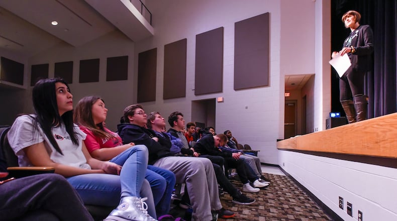 Christy Burch, director of prevention at the Women’s Crisis Center, makes a presentation to students at Lakota East Freshman School Tuesday, April 4 in Liberty Township. Burch represented one of the three organizations who competed for money raised by the students. The Women’s Crisis Center was the winner. NICK GRAHAM/STAFF