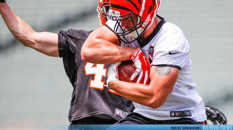 Cincinnati Bengals tight end Matt Lengel makes a catch defended by safety Clayton Fejedelem on the first day of mandatory mini camp Tuesday, June 14 at Paul Brown Stadium in Cincinnati. NICK GRAHAM/STAFF