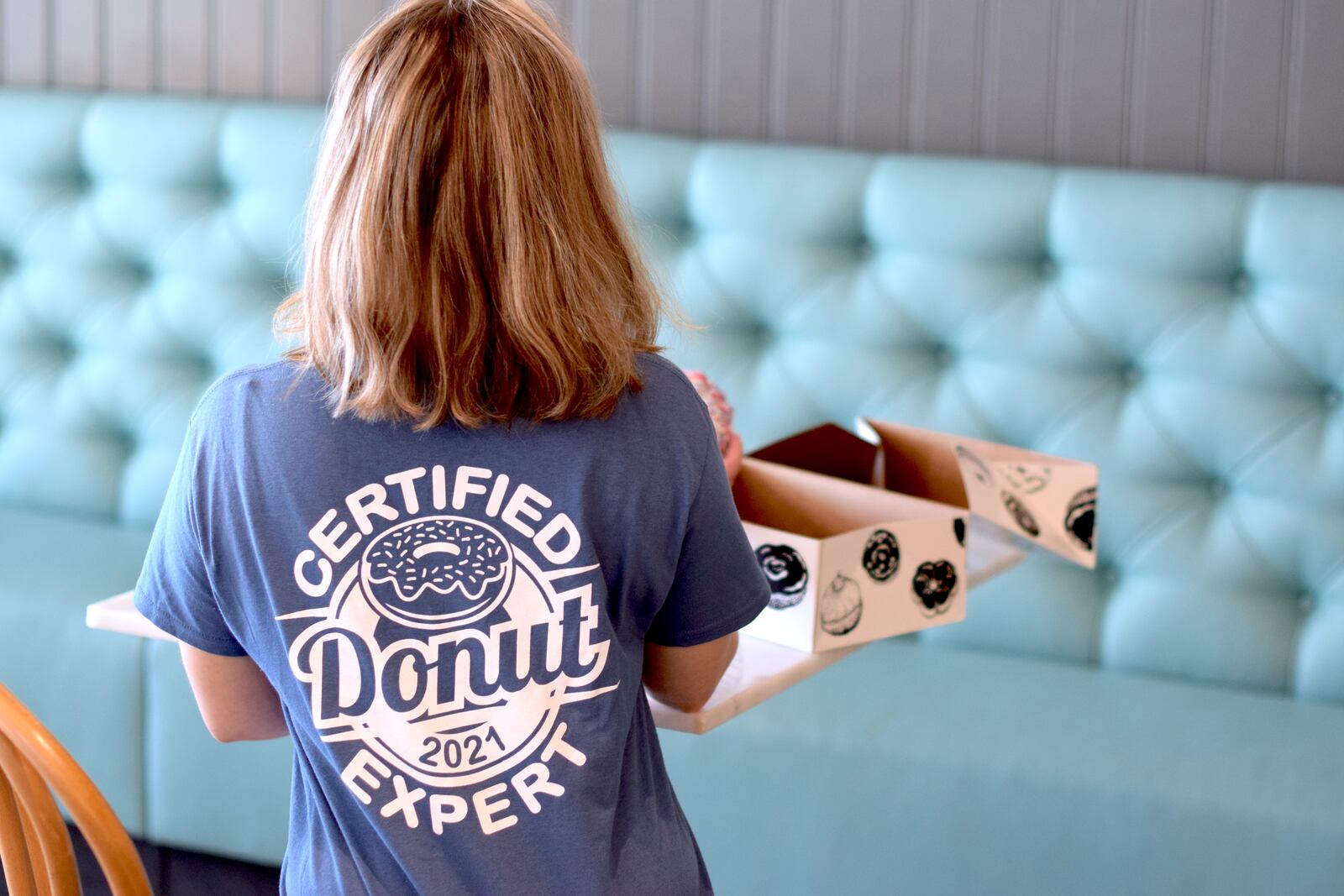 The Butler County Visitors Bureau recently unveiled the 2021 ‘Certified Donut Expert’ T-Shirt. CONTRIBUTED