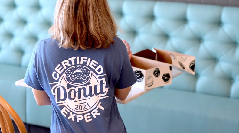 The Butler County Visitors Bureau recently unveiled the 2021 ‘Certified Donut Expert’ T-Shirt. CONTRIBUTED