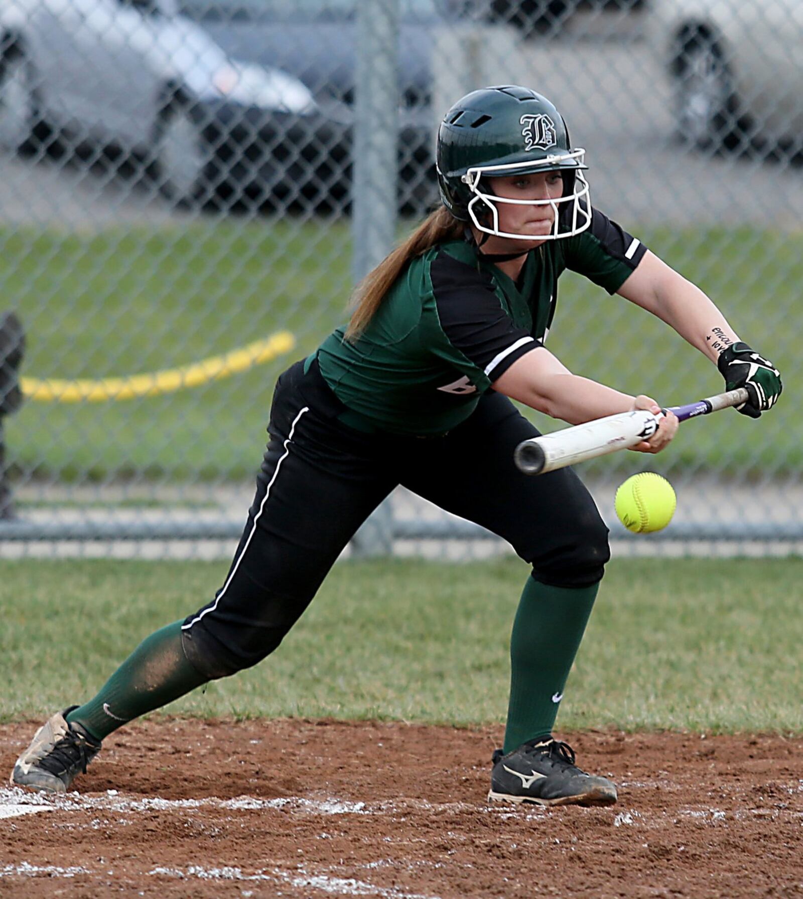 Badin’s Shelby Schmitt lays down a sacrifice bunt during Monday’s game against Wilmington at Mueller Stadium in Hamilton. CONTRIBUTED PHOTO BY E.L. HUBBARD