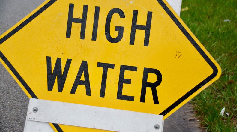 Tuesday morning, April 3, 2018, rains lead to some flooding around Butler County, including on along a hillside on Woodridge Boulevard, just west Ohio Dixie Highway, in the city of Fairfield.
