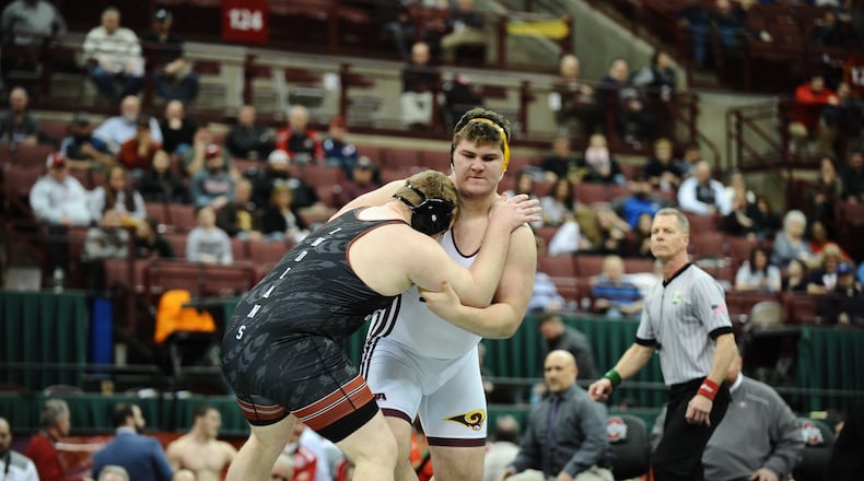 Ross Alex Coleman (right) won a Division II state wrestling championship last season and finished 49-3. GREG BILLING/CONTRIBUTED
