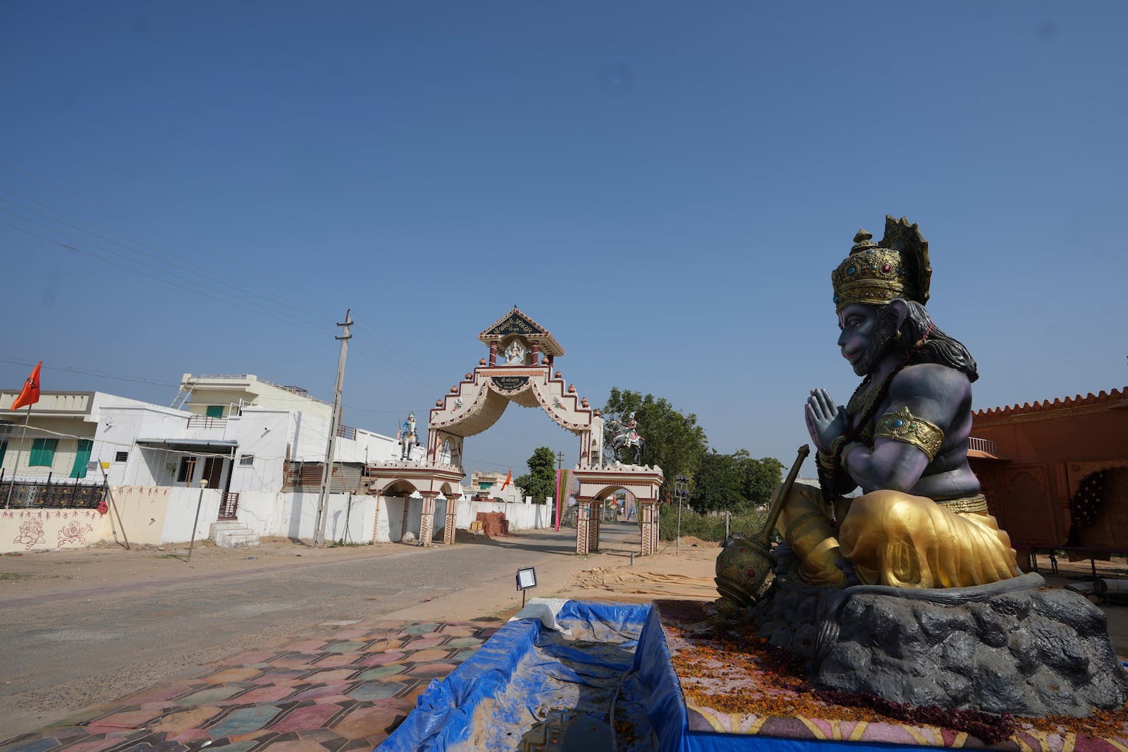 FILE - A statue of Monkey God Hanuman, installed as part of a religious celebrations, is seen in front of an entrance gate of Dingucha village in Gandhinagar, India, Tuesday, Nov. 12, 2024. (AP Photo/Ajit Solanki, File)