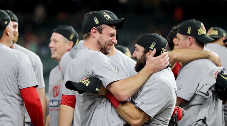 The Nationals’ Max Scherzer and Adam Eaton celebrate after defeating the Houston Astros 6-2 in Game Seven to win the 2019 World Series in Game Seven of the 2019 World Series at Minute Maid Park on October 30, 2019 in Houston, Texas. (Photo by Elsa/Getty Images)