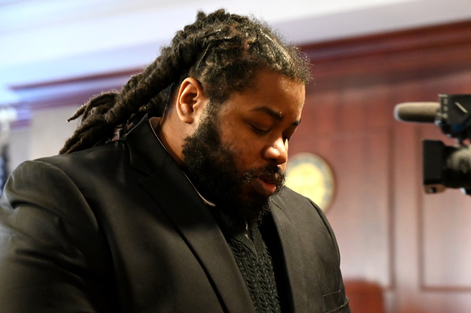 Anthony Brown, 35, was sentenced to 26 years to life in the double 2022 shooting that killed Adam Black and wounded Eric Ruff. He pleaded guilty in September to counts, including murder with a gun specification. Pictured is Brown being escorted out of the courtroom of Butler County Common Pleas Judge Dan Haughey on Monday, Dec. 15, 2025. MICHAEL D. PITMAN/STAFF