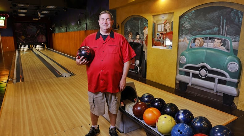 Butler County Common Pleas Court Judge Dan Haughey is an avid bowler in his off time and spends time with family and friends in his home bowling alley. NICK GRAHAM/STAFF