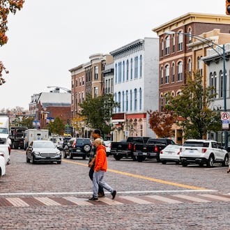 People are seen walking on High Street in Oxford. FILE PHOTO