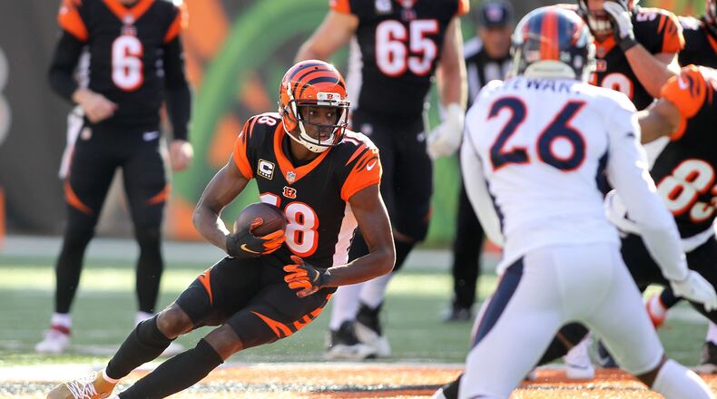 CINCINNATI, OH - DECEMBER 2: A.J. Green #18 of the Cincinnati Bengals runs with the ball during the first quarter of the game against the Denver Broncos at Paul Brown Stadium on December 2, 2018 in Cincinnati, Ohio. (Photo by John Grieshop/Getty Images)