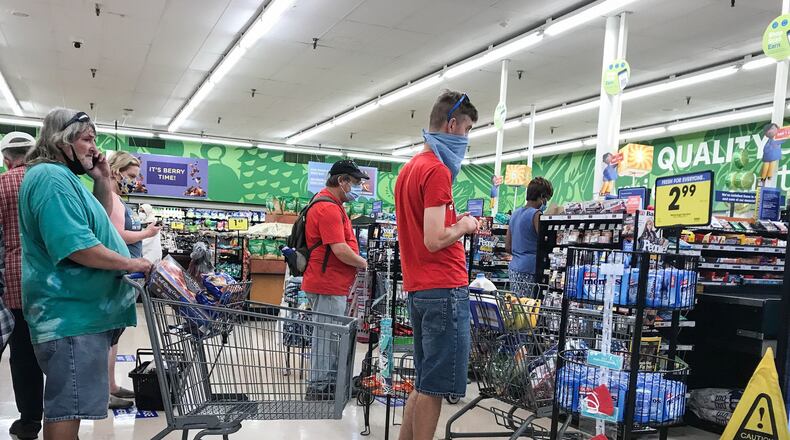 People wait in line at the Krogers on Wayne Ave. Thursday July 9, 2020. The U.S. Census Bureau looked at how Americans spent their stimulus checks. JIM NOELKER/STAFF