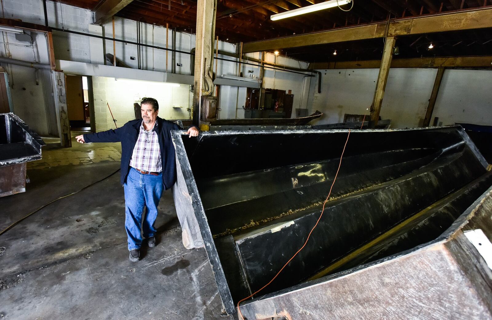 Water Taxi Marine recently bought a building on Forest Avenue in Hamilton to construct boats. Owner Todd Allmand started in the boat business with his dad in Miami, Florida but moved to Ohio due to lower freight cost when shipping his boats, some of which are nearly forty feet long and twelve feet wide. This is a mold that will be used to construct a fiberglass hull for a catamaran. NICK GRAHAM/STAFF