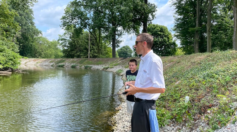 Anthony Macke takes advantage of sunny summer days to fish at Fountain Park in Piqua on his lunch break.