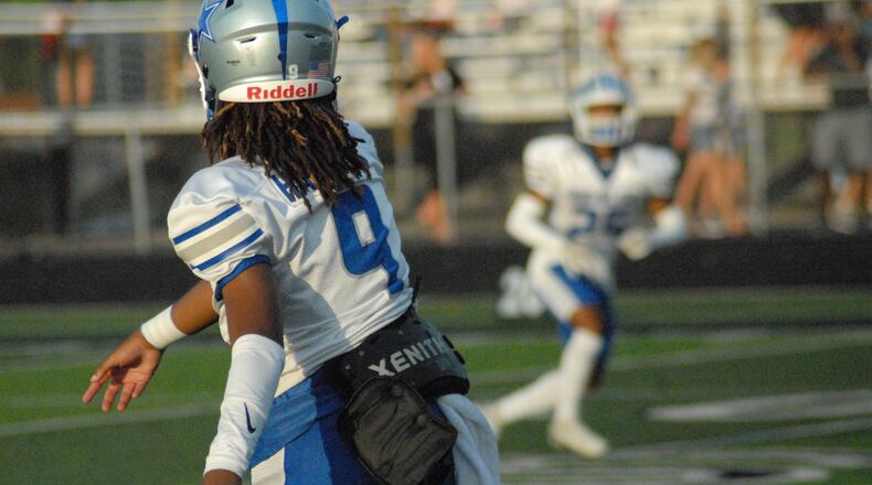 Hamilton's Antonio Mathis throws a pass against Lakota East on Friday. Chris Vogt/CONTRIBUTED