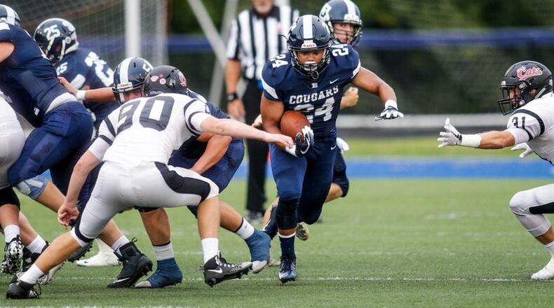 Edgewood’s Elijah Williams looks for running room through the Franklin on Friday night at Kumler Field in St. Clair Township. NICK GRAHAM/STAFF